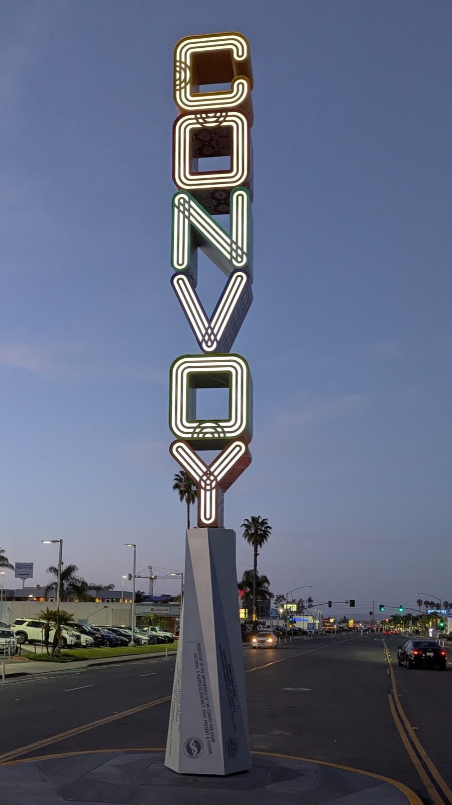 Convoy District gateway neon sign on Convoy Street in San Diego at dusk