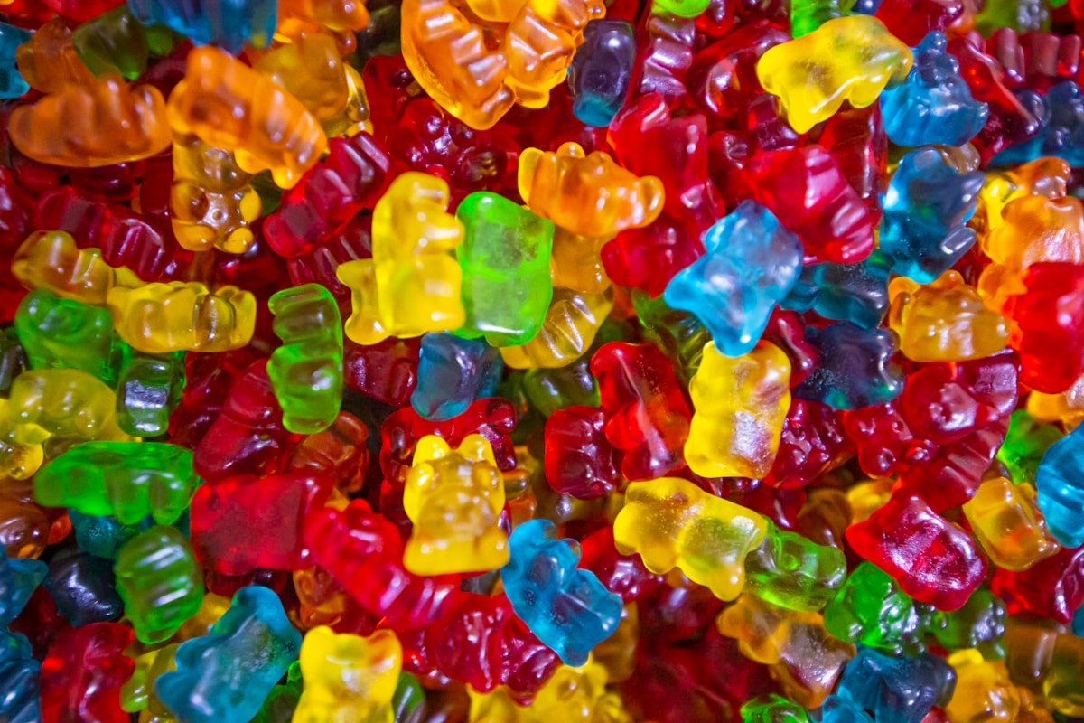 Colorful cannabis gummies in red, yellow, green, and blue, the homemade THC edible format made with gelatin or pectin and infused with decarboxylated cannabis