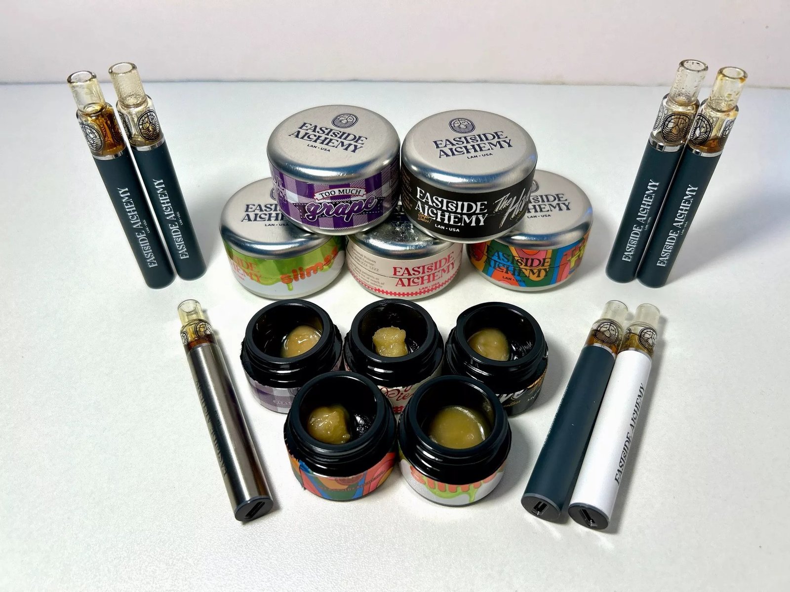 Eastside Alchemy live rosin jars and disposable vapes spread, the Lansing Michigan solventless concentrates producer