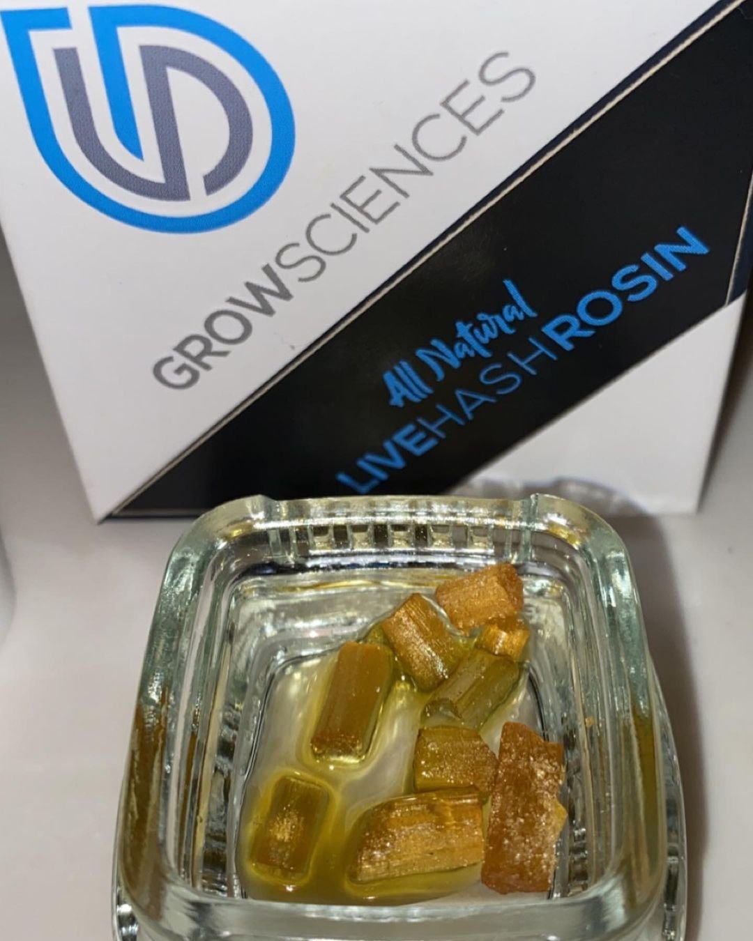 Grow Sciences All Natural Live Hash Rosin in glass concentrate jar with cold-cure rosin chunks