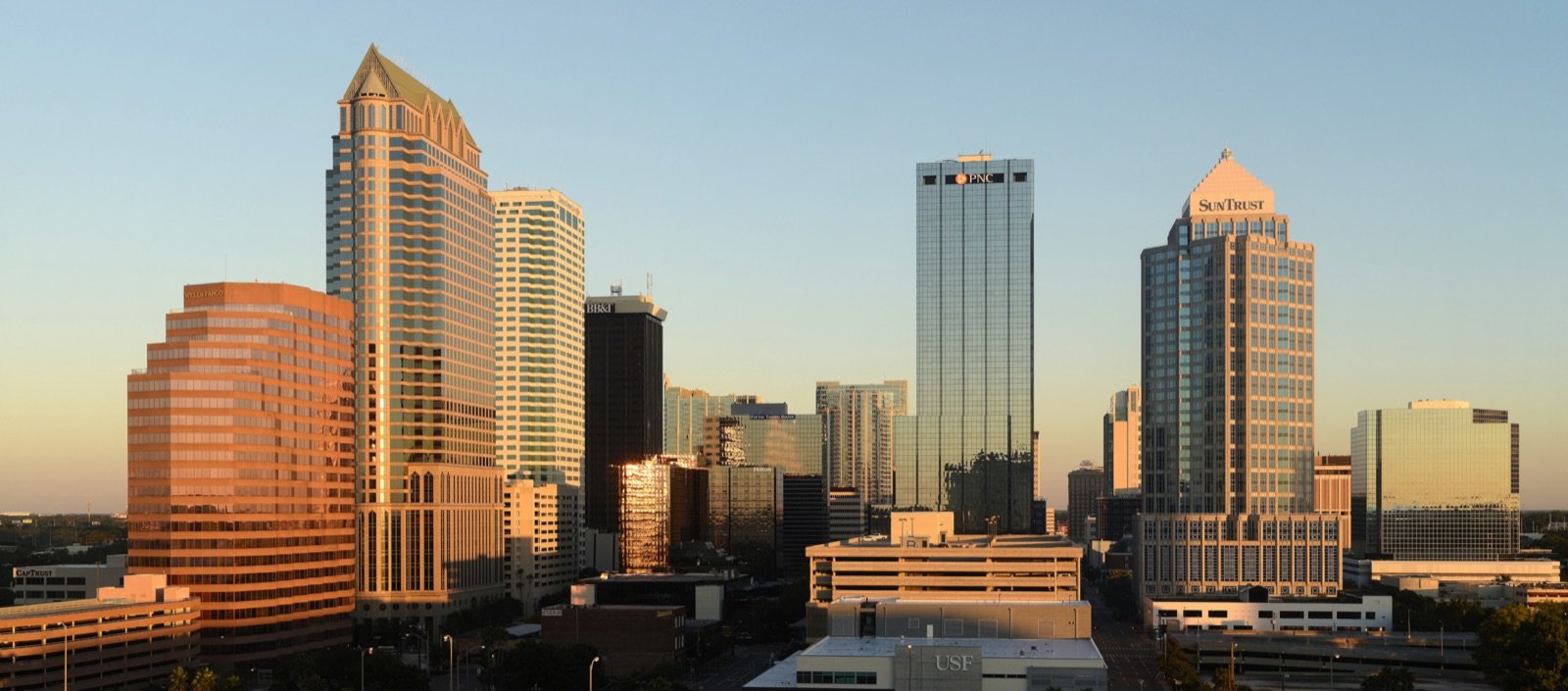 Tampa Florida downtown skyline at golden hour with high-rise office towers, the medical cannabis MMTC corridor that anchors Florida's twenty-five licensed brands