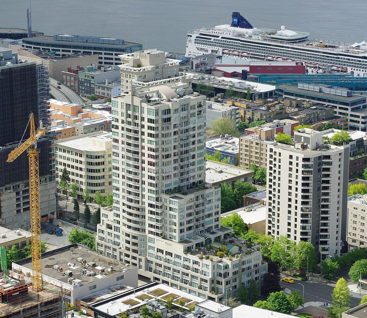 Belltown Seattle waterfront apartment buildings with cruise ship in Elliott Bay background