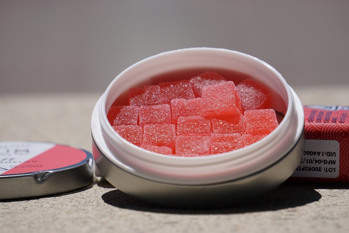 Pink sugared cannabis gummies in an open tin, representative of the Baked Bros and OGeez edibles stocked at JARS Metrocenter Phoenix