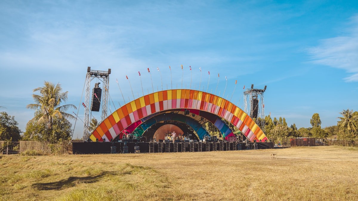 Outdoor festival main stage at dusk on the polo grounds near the El Paseo and STIIIZY Palm Desert dispensary corridor
