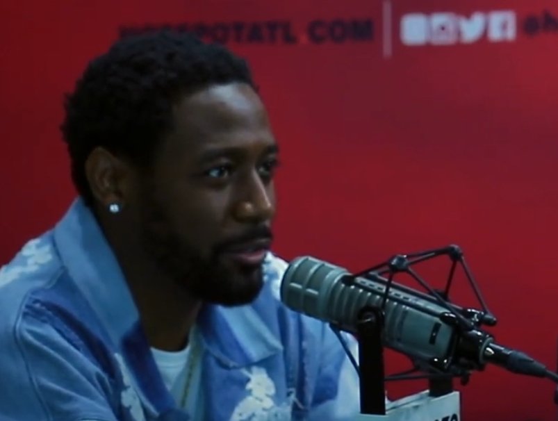 Stand-up comedian Kountry Wayne being interviewed on a podcast, the skit-era comic the algorithm built and the theater crowd validated.