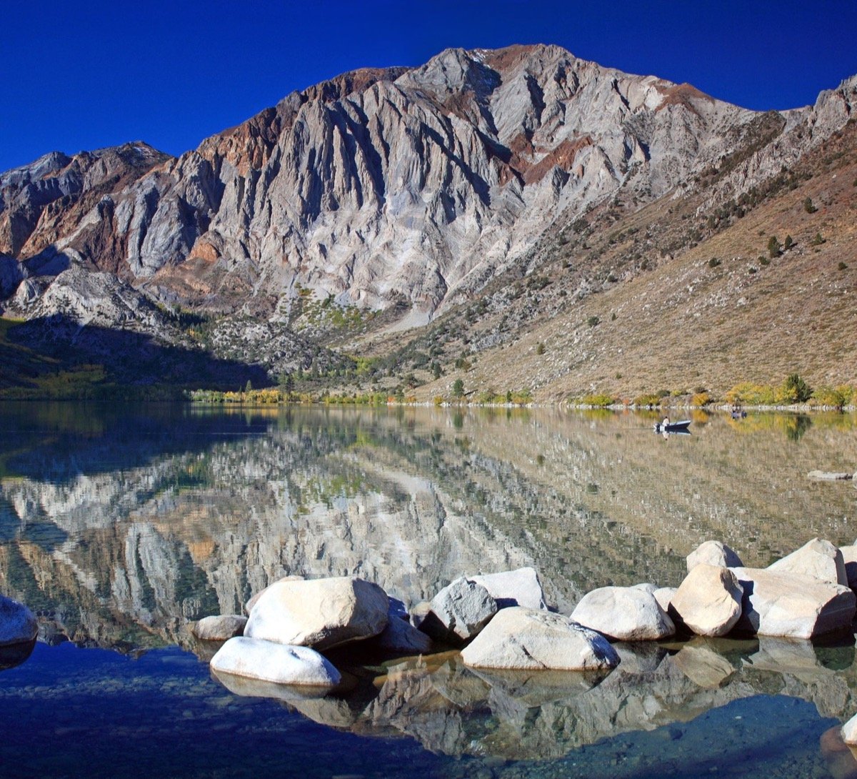 Convict Lake reflecting Laurel Mountain in the Eastern Sierra outside Mammoth Lakes, the namesake corridor where Green Mammoth runs its second-floor cannabis counter on Laurel Mountain Road.