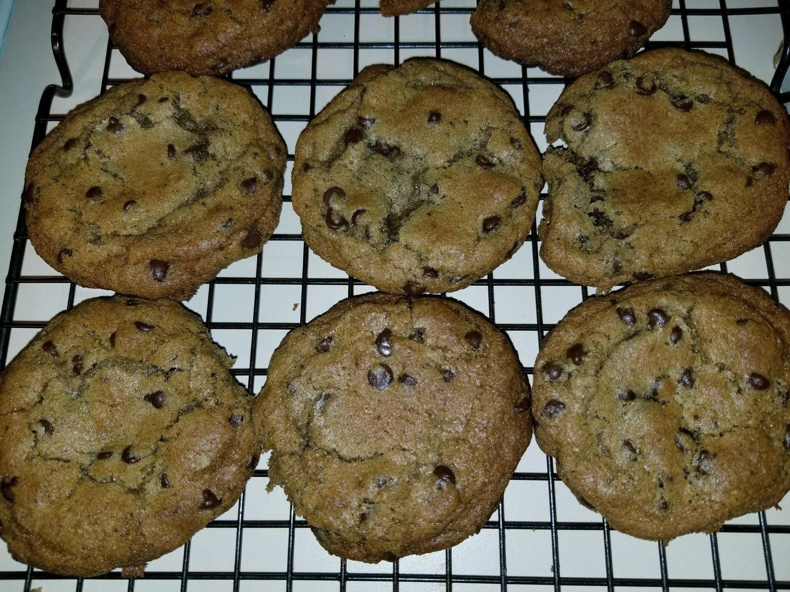 Cannabis-infused chocolate chip cookies on a wire cooling rack, representative of the artisan-baked edible category Nature's Grace and Wellness produces from its Vermont, Illinois cultivation and processing facility