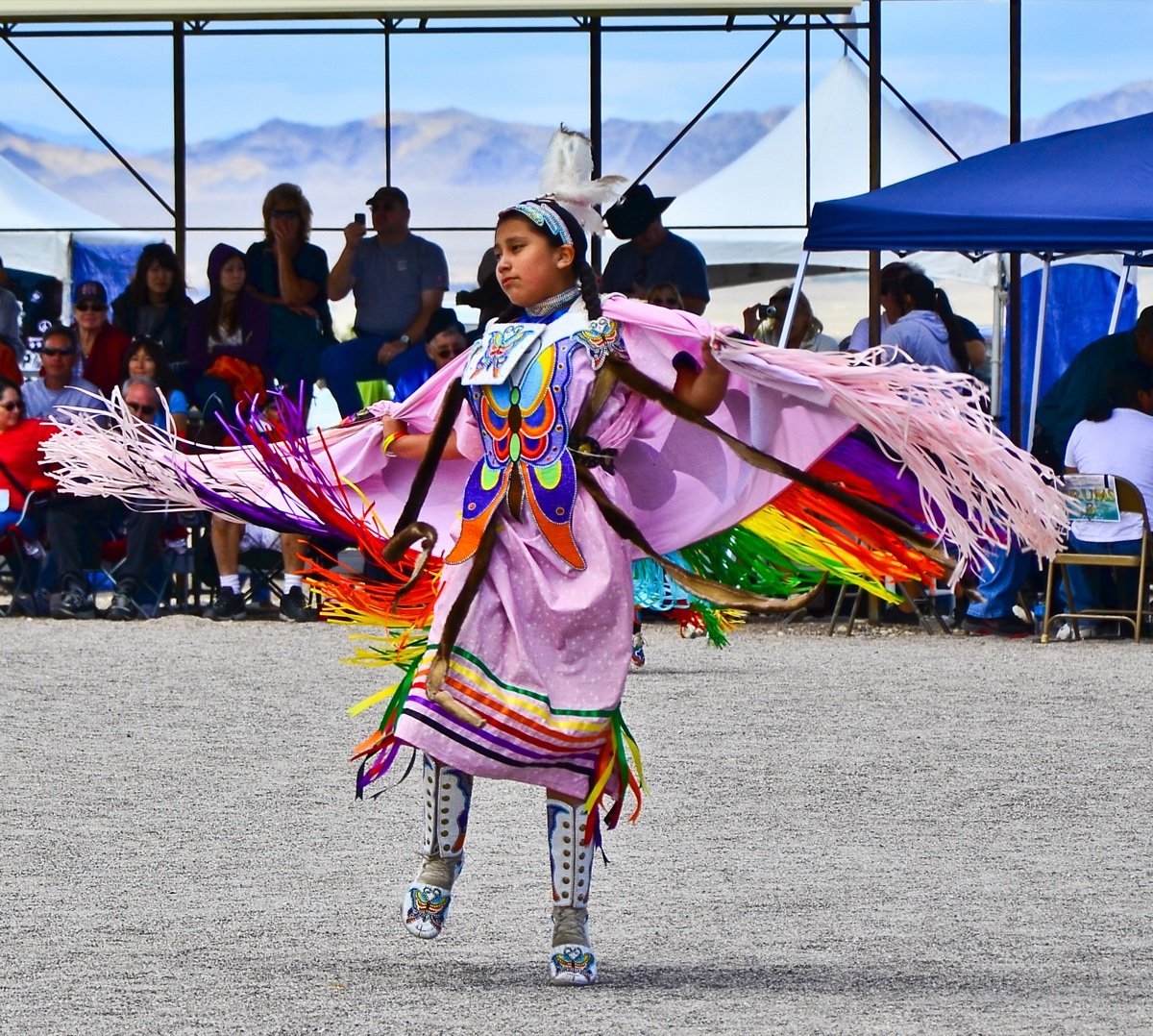 A Las Vegas Paiute Tribe member in regalia at a community gathering, the same sovereign nation that licenses the NuWu Cannabis Marketplace on Paiute Circle north of downtown.