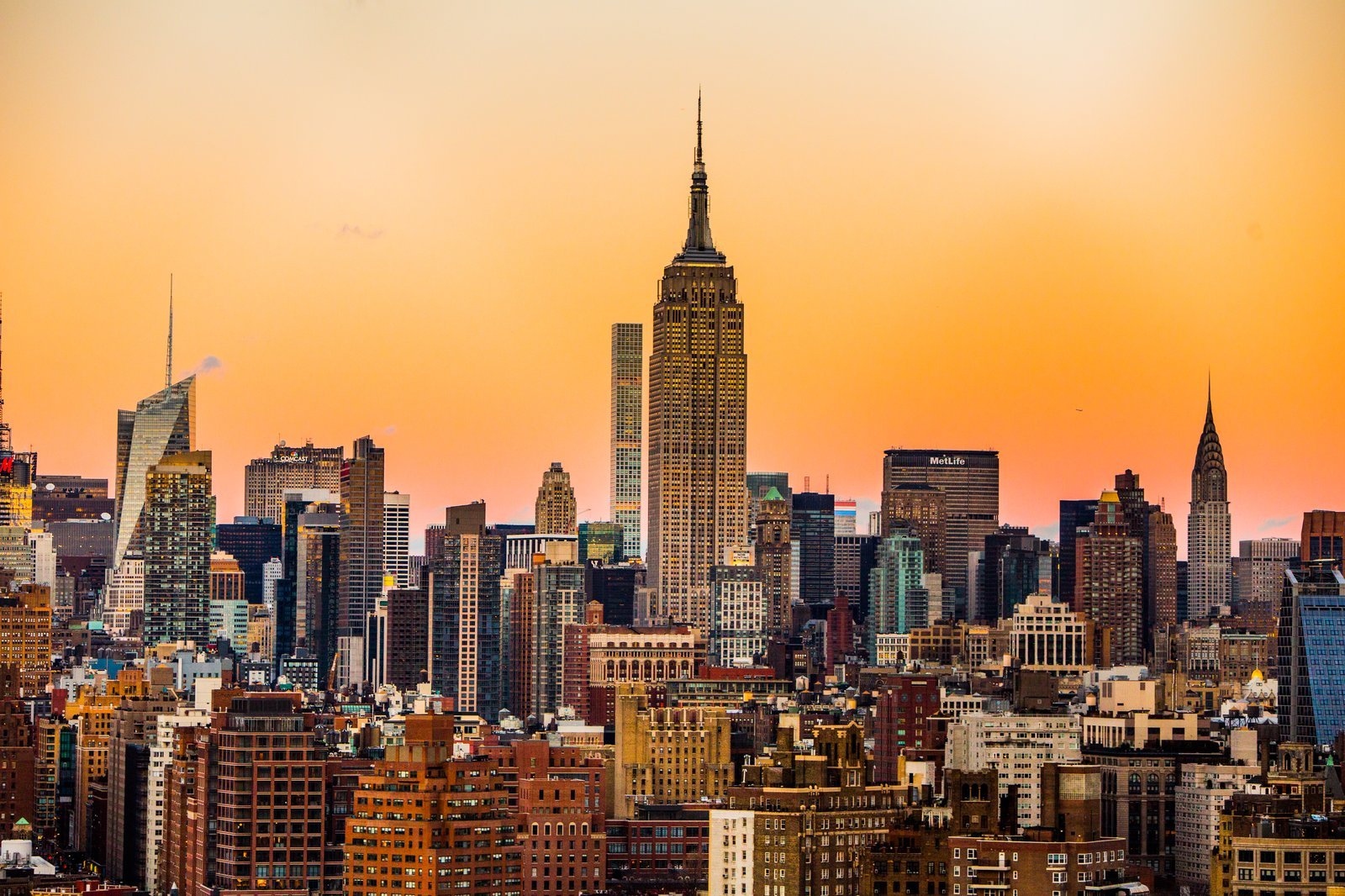 Midtown Manhattan skyline at sunset with the Empire State Building and Chrysler Building in view
