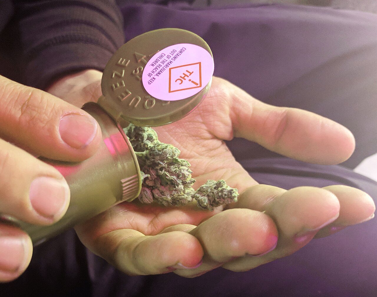 Regulated cannabis container with Colorado THC compliance sticker, the kind of state-legal packaging Leafs by Snoop launched into in Denver in November 2015
