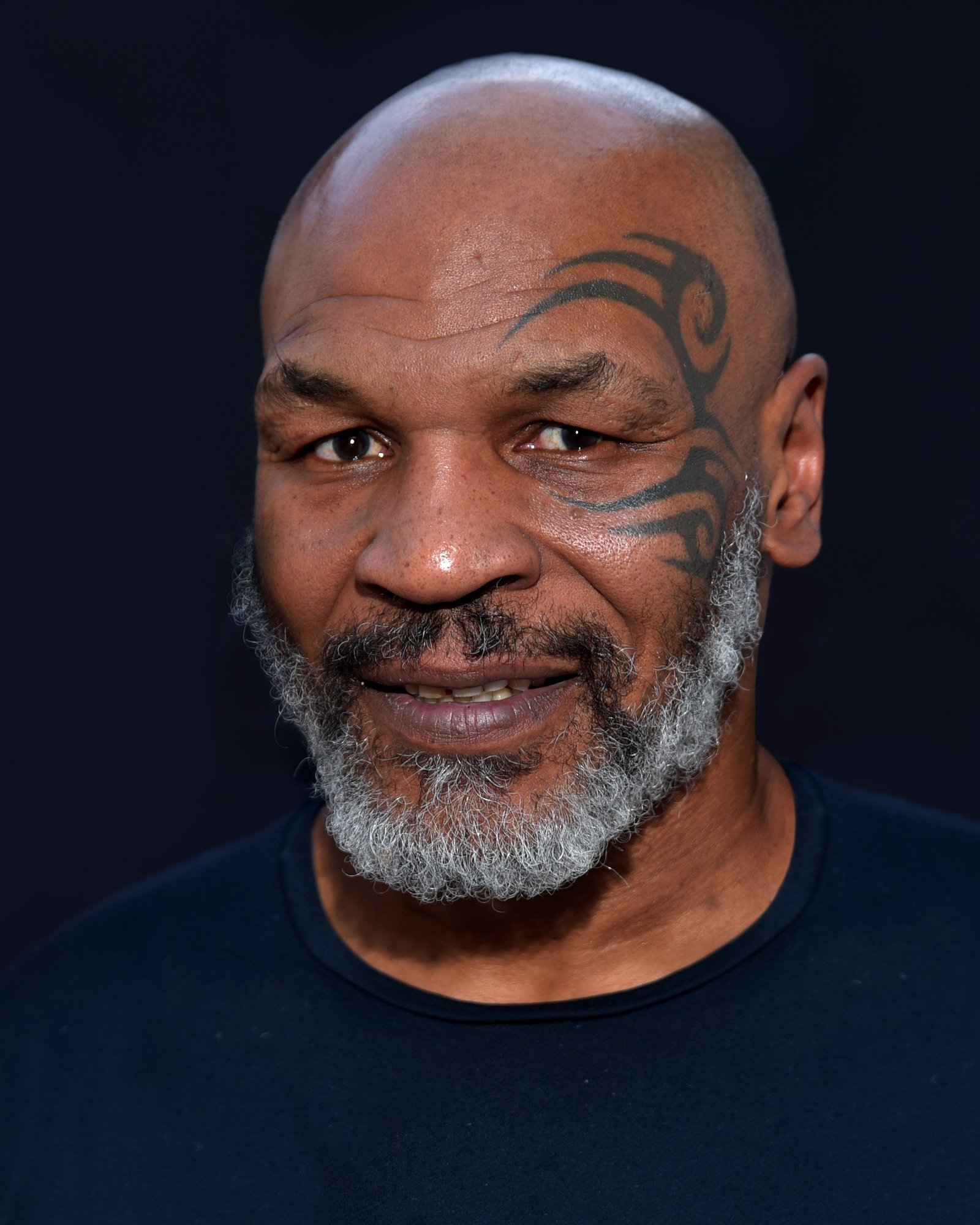 Mike Tyson photographed in Los Angeles in June 2019, the year the Hotboxin podcast began the on-camera daily cannabis consumption that anchors the Tyson 20 brand authenticity argument