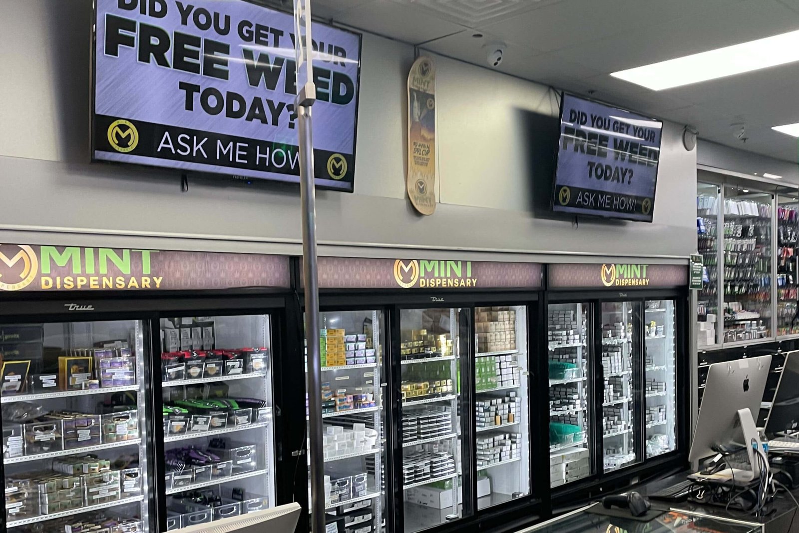 Mint Dispensary branded coolers stocked with edibles and concentrates inside the Tempe location