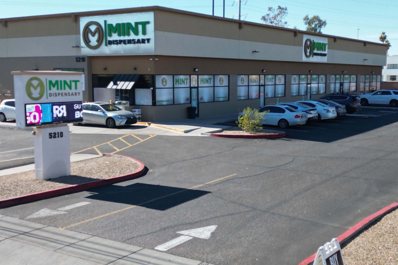 The Mint Cannabis Tempe storefront at 5210 with parking lot and dispensary signage