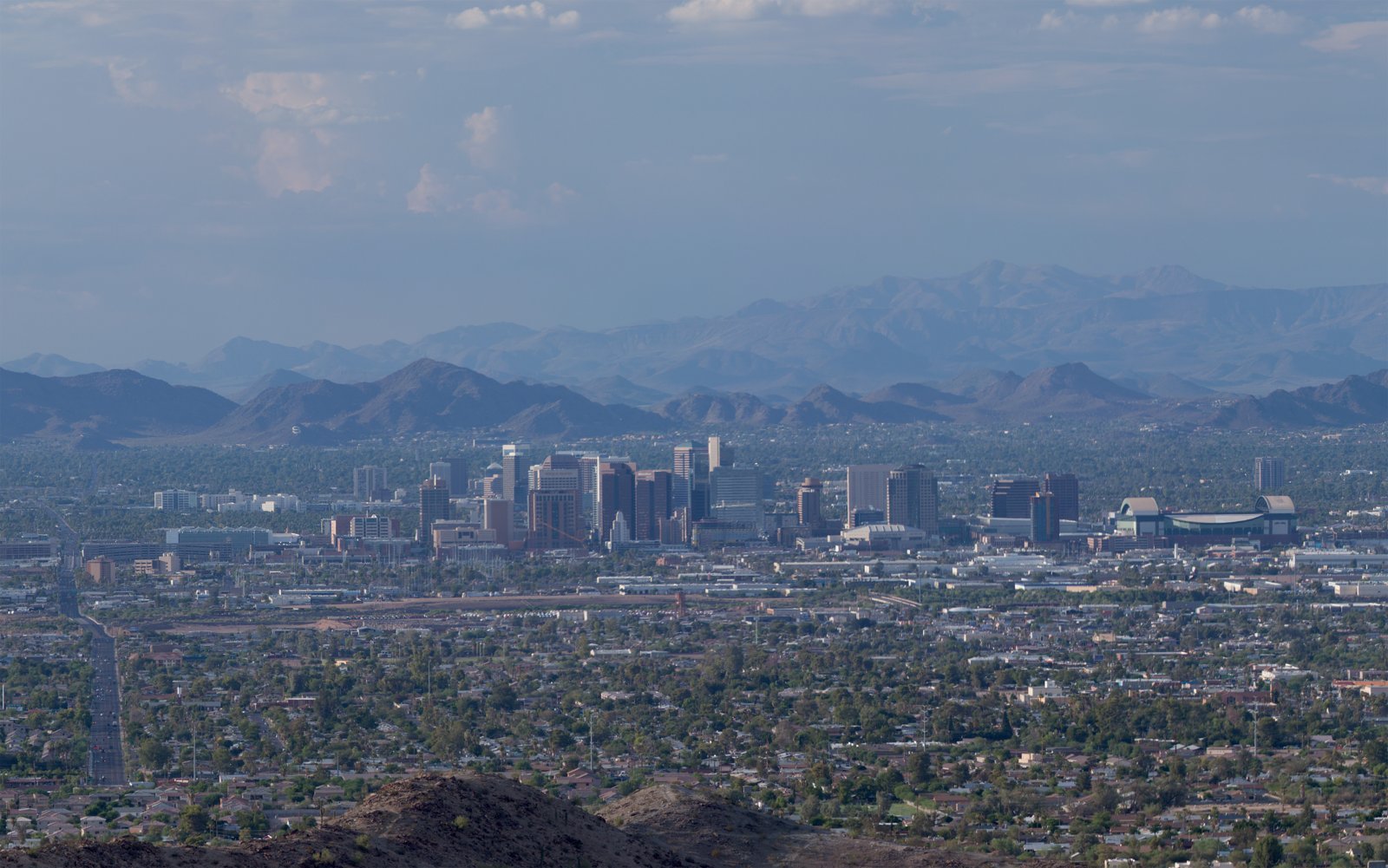 Downtown Phoenix Arizona skyline with high-rise buildings against a daytime sky