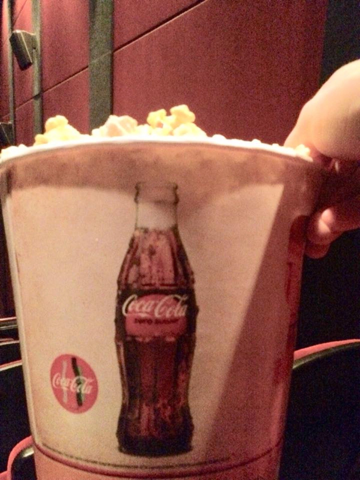 Movie theater popcorn in a striped paper bucket, the snack to pair with the Project MKULTRA cold open of Pineapple Express