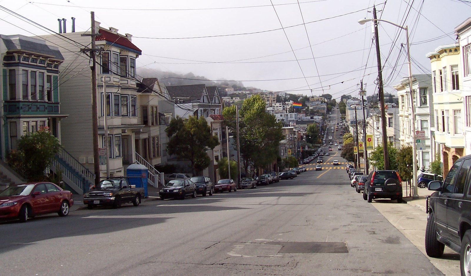 Victorian houses on a hilly residential street in the Eureka Valley Castro neighborhood of San Francisco near Eureka Sky dispensary