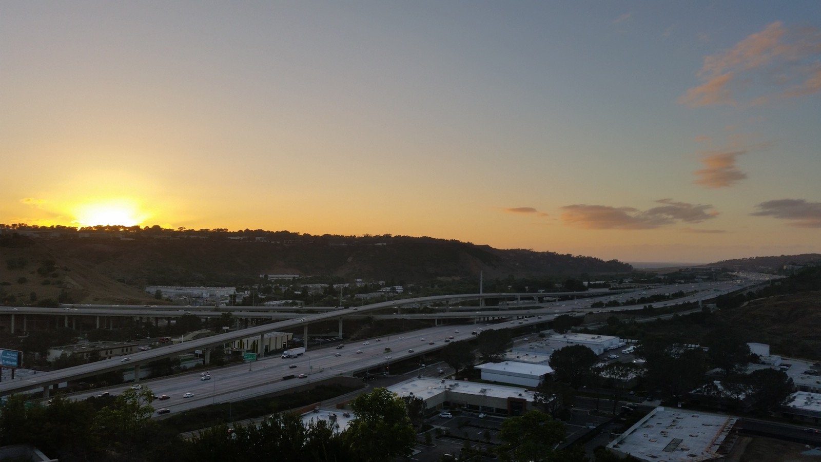 Interstate 805 freeway curving through Sorrento Valley San Diego at sunset, the corridor most Torrey Holistics customers drive in on