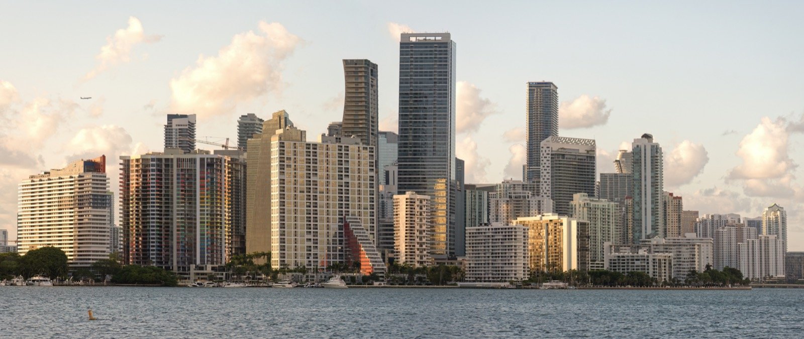 Miami skyline at golden hour from Biscayne Bay with Brickell high-rises in the background