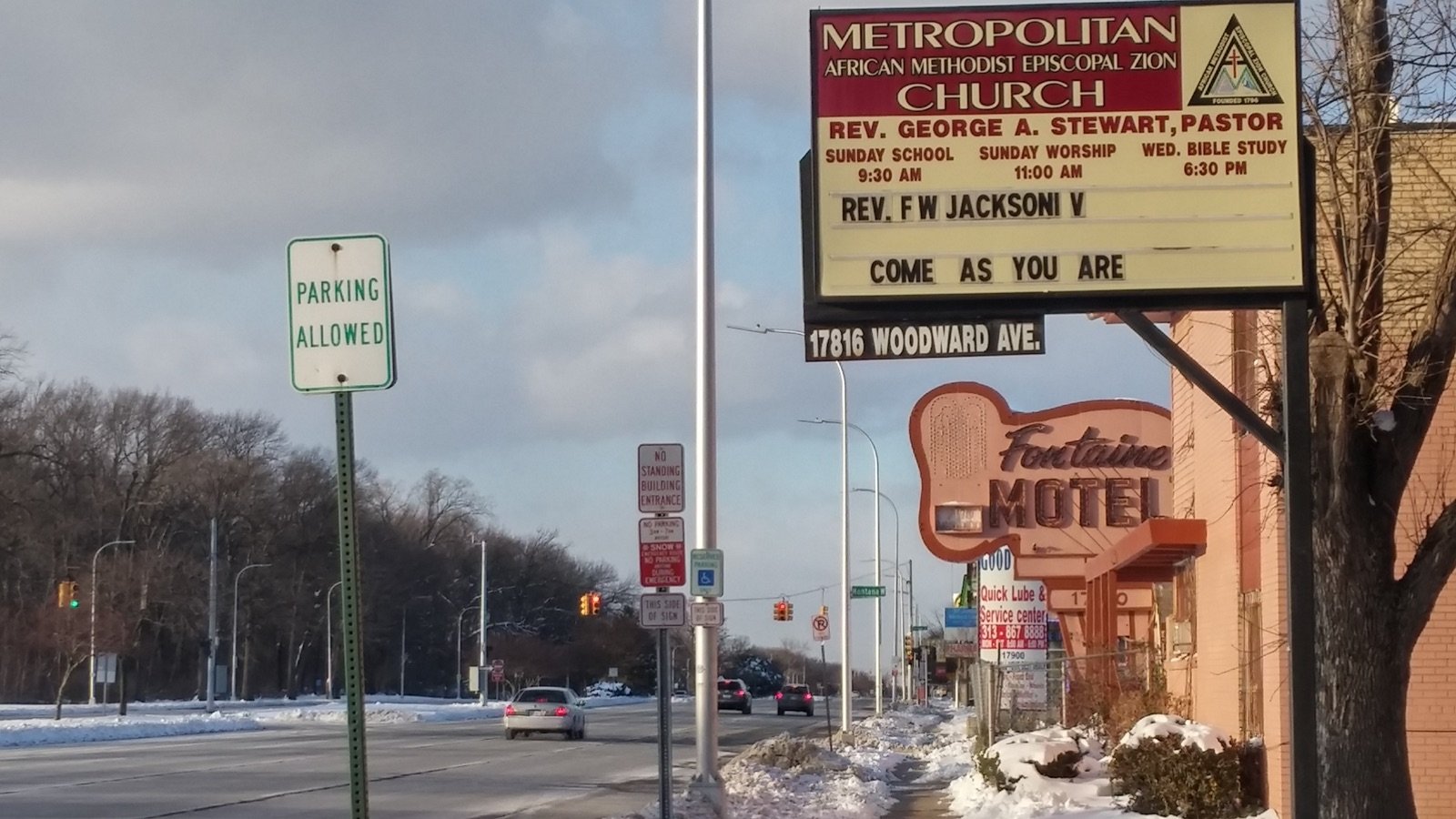 Woodward Avenue in Detroit looking north with the Metropolitan AME Zion Church marquee and the vintage Fontaine Motel neon sign in the foreground