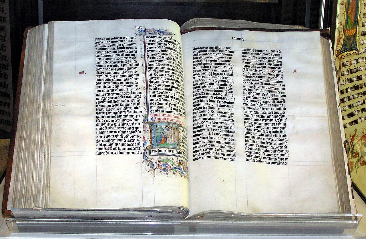 Open Bible on a stand showing the thin lightweight pages people ask about using to roll weed