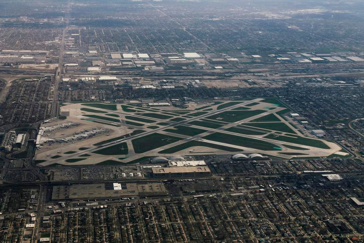 Aerial view of Chicago Midway International Airport surrounded by the Southwest Side bungalow grid, the airfield three blocks south of Ascend Midway dispensary on Archer Avenue